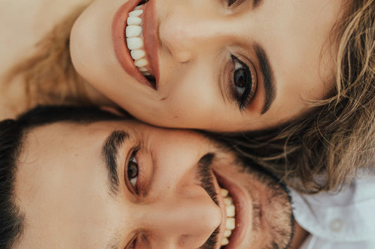 a couple face to face  smiling bright 
