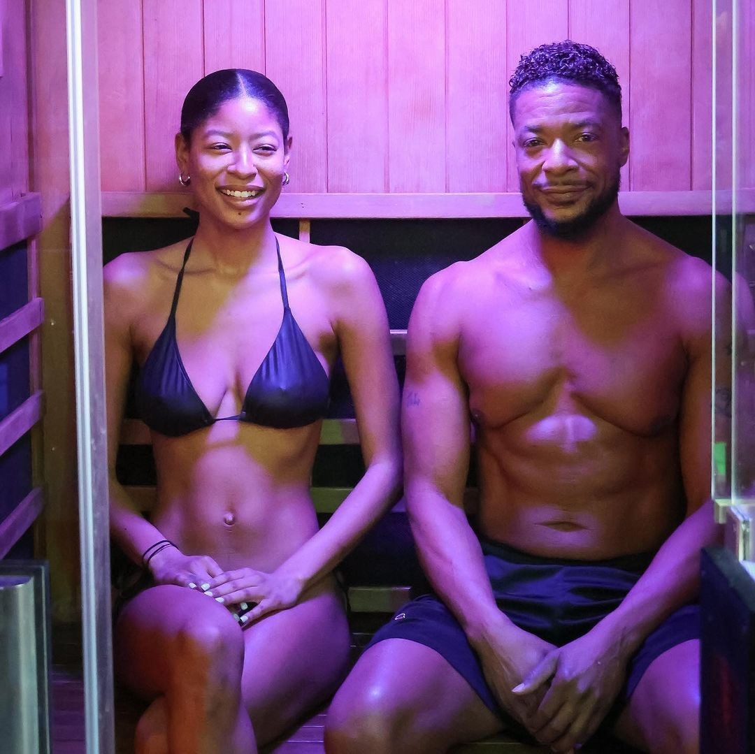a woman and a man in swimwear sitting in Clearlight Infrared Sauna 