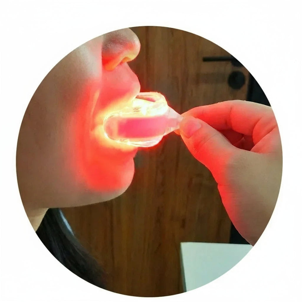 Device in use — relaxing red light illuminating the mouth area